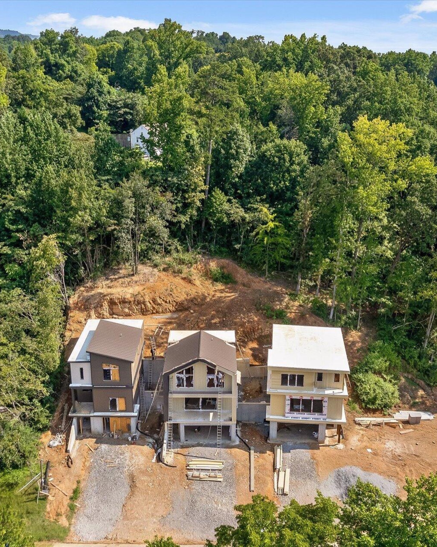 Aerial view of the first three residences under construction on Lullwater Road