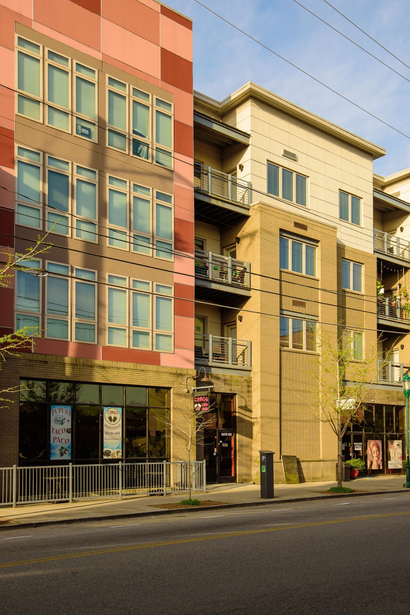 The full street elevation of 26 East Main, four storeys of residential over ground-floor storefronts