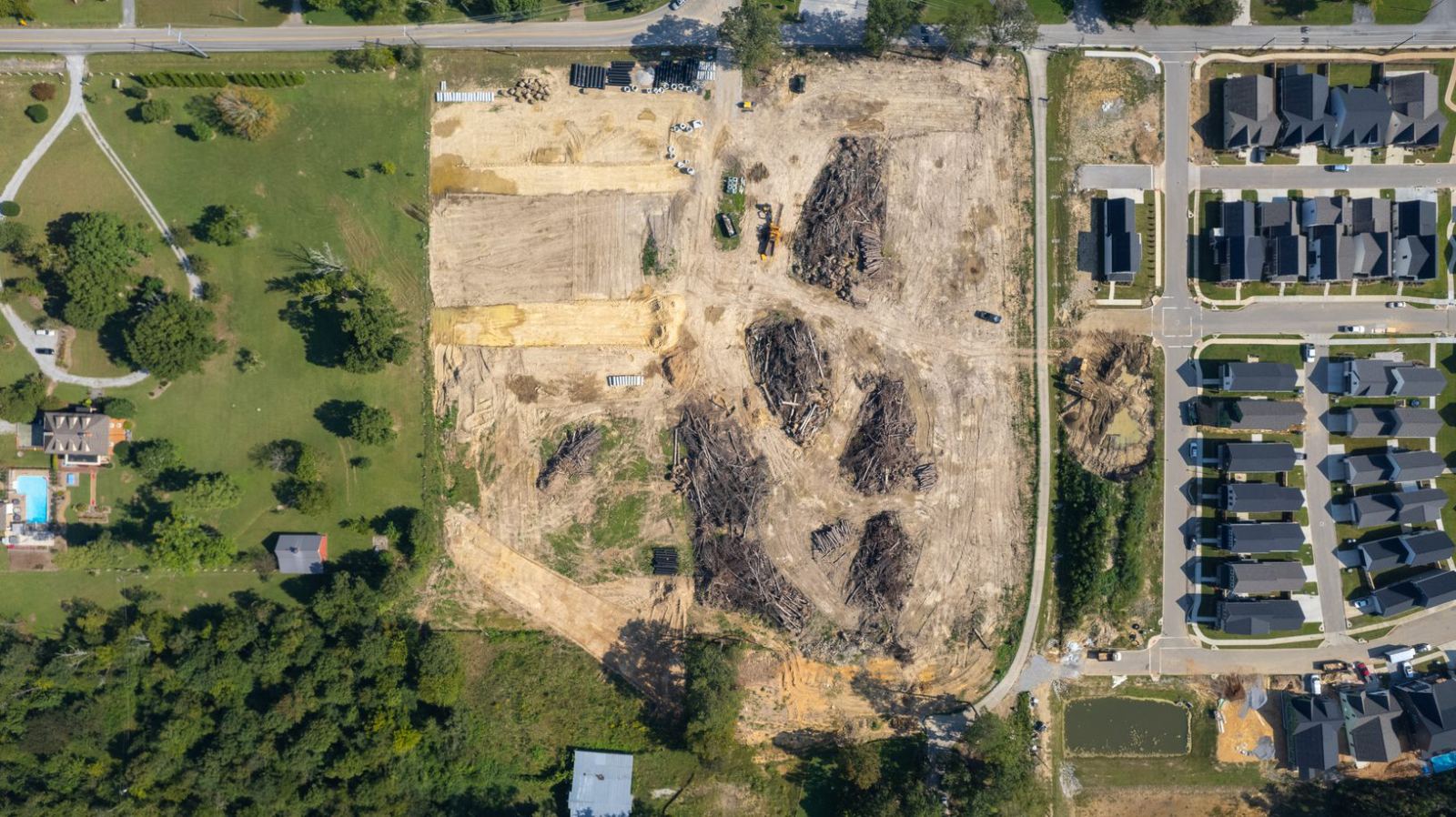 Overhead view of the site between the neighboring pasture and the finished streets