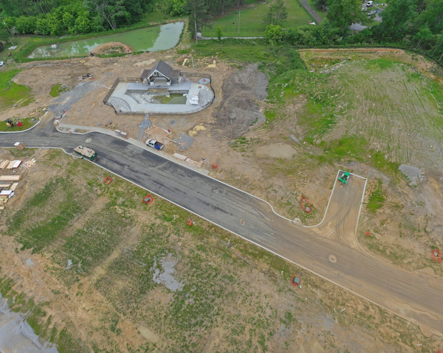 Aerial view of the pool, poolhouse and community area under construction