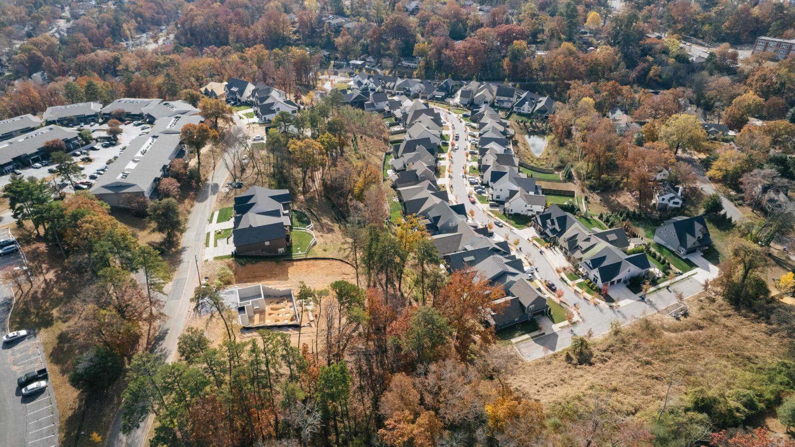 Aerial view of rows of homes along a curving street