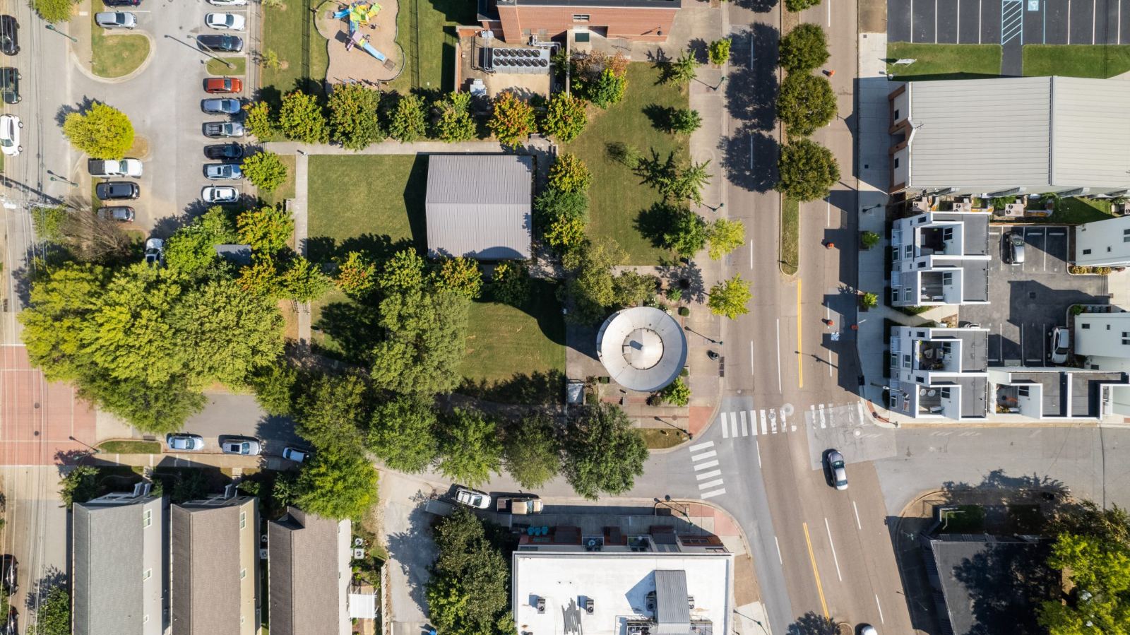 Aerial view of Water Tower Park between the street, Battle Academy and downtown housing